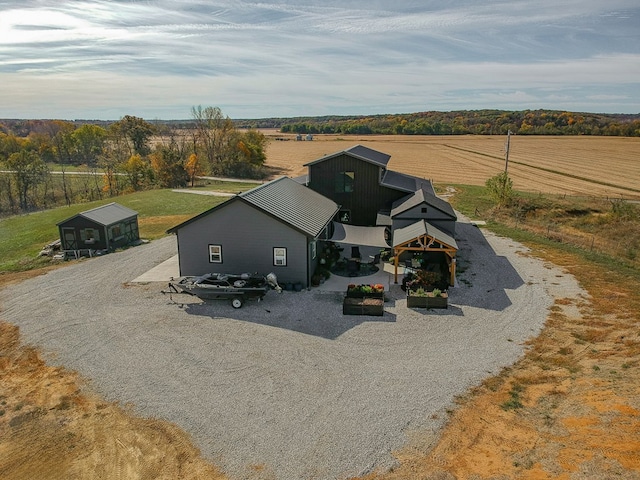 birds eye view of property with a rural view