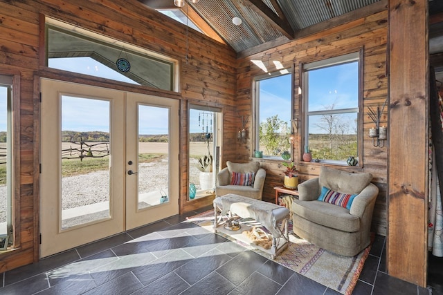 sunroom with vaulted ceiling with beams and french doors