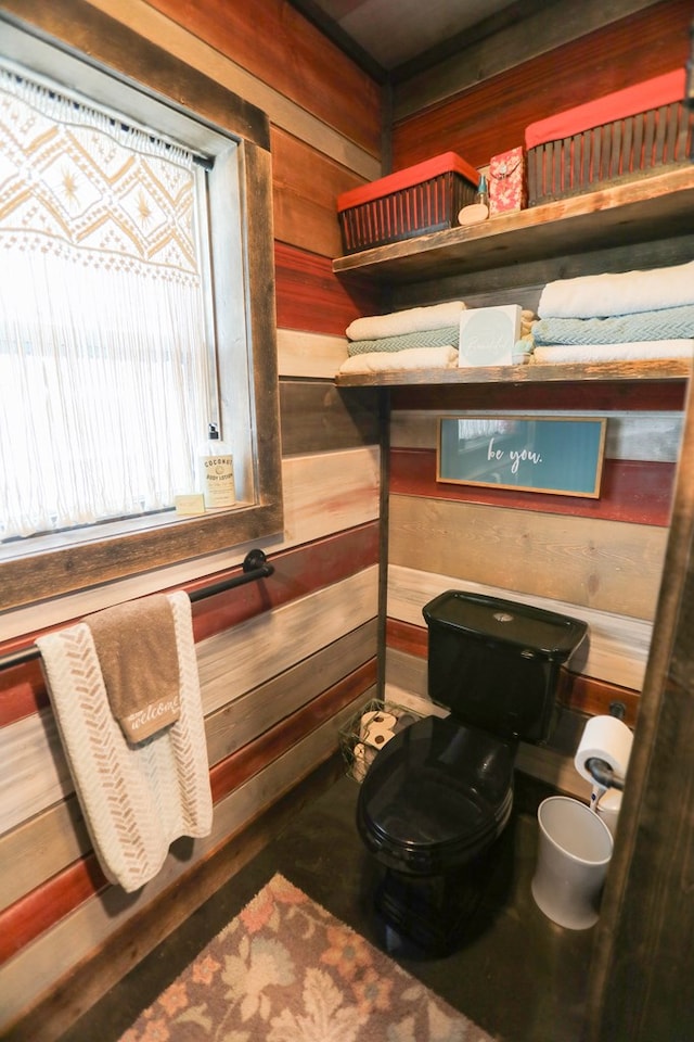 bathroom with wooden walls