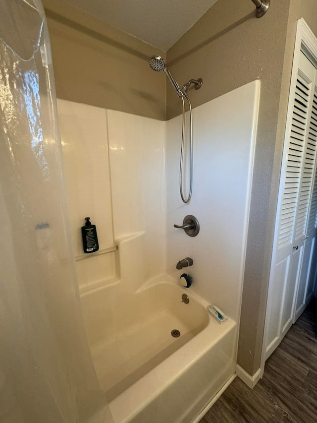 113 Elm St, Milan, MO 63556 - full bathroom featuring wood finished floors and bathing tub / shower combination