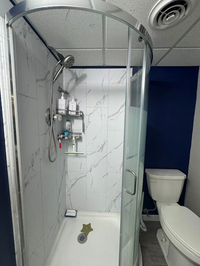 113 Elm St, Milan, MO 63556 - full bath with toilet, a marble finish shower, and wood finished floors