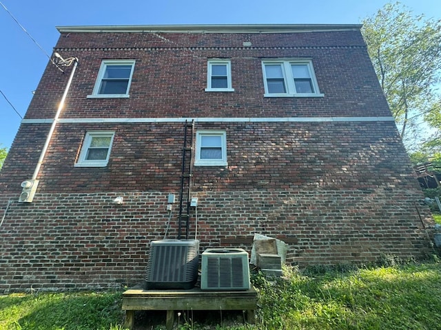 113 Elm St, Milan, MO 63556 - view of side of home with brick siding and central air condition unit