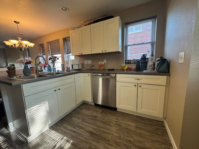 113 Elm St, Milan, MO 63556 - kitchen featuring dishwasher, a sink, dark wood finished floors, a peninsula, and a textured wall
