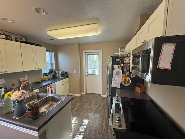 113 Elm St, Milan, MO 63556 - kitchen with appliances with stainless steel finishes, white cabinetry, healthy amount of natural light, and recessed lighting