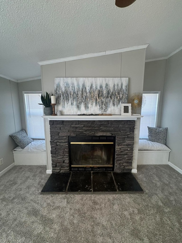 room details featuring crown molding, baseboards, carpet flooring, a fireplace, and a textured ceiling