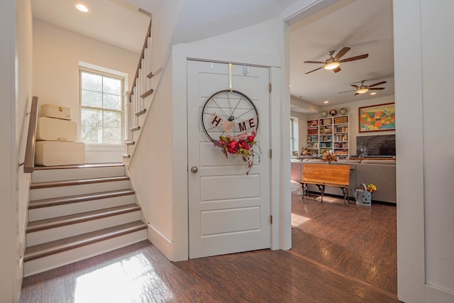 entrance foyer with recessed lighting, stairway, and wood finished floors