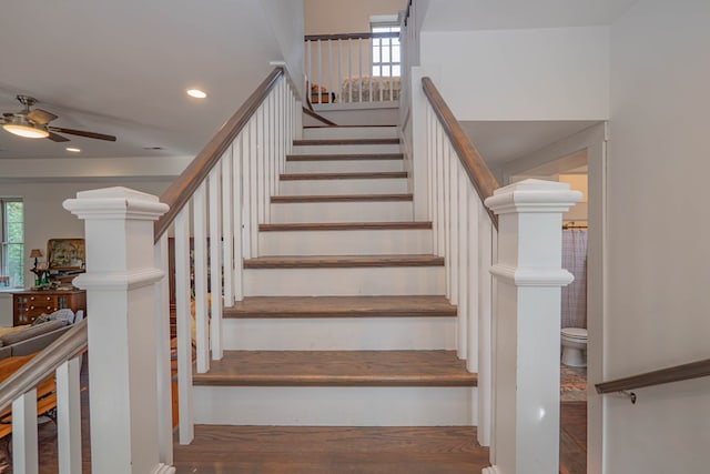 staircase featuring a ceiling fan and recessed lighting