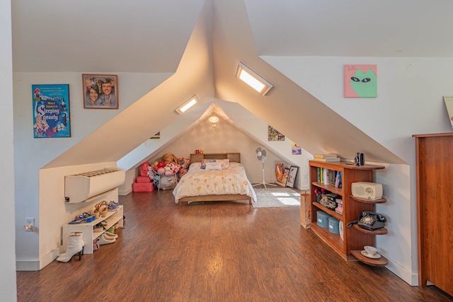 bedroom featuring vaulted ceiling, baseboards, and wood finished floors