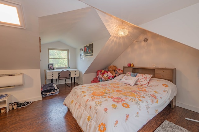 bedroom with vaulted ceiling, baseboards, and wood finished floors