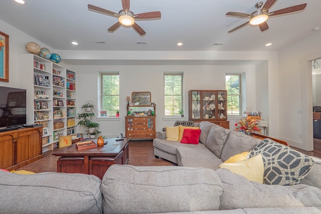 living area featuring visible vents, wood finished floors, and recessed lighting