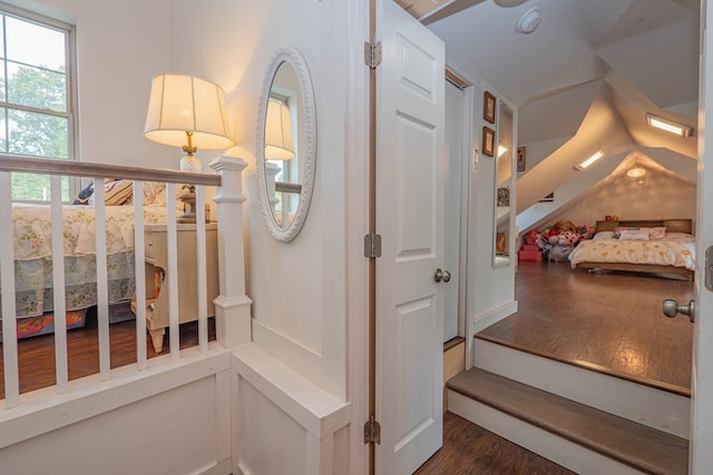 staircase featuring wood finished floors