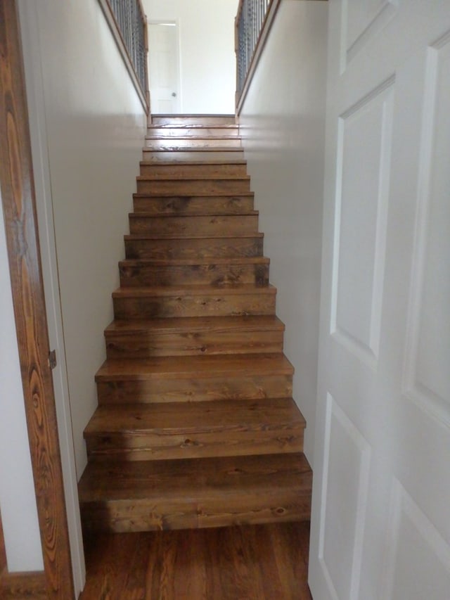 stairway with wood-type flooring