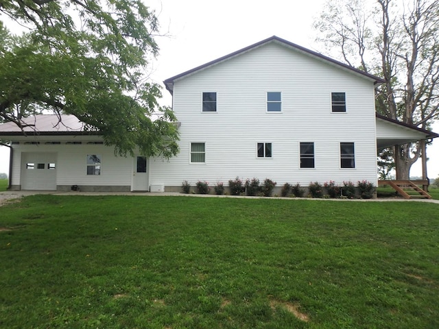 view of side of property with a yard