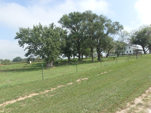 view of yard with a rural view