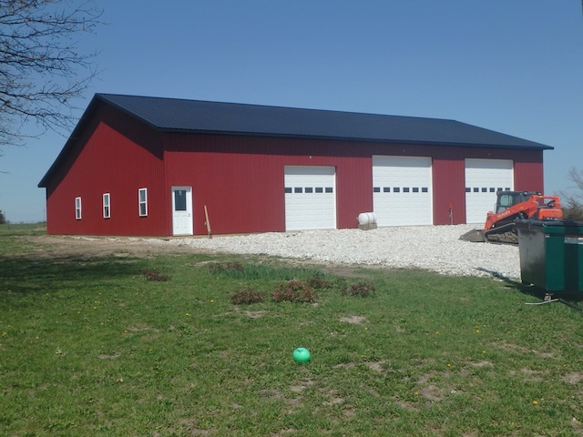 garage featuring a yard