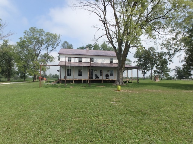 back of house featuring a lawn