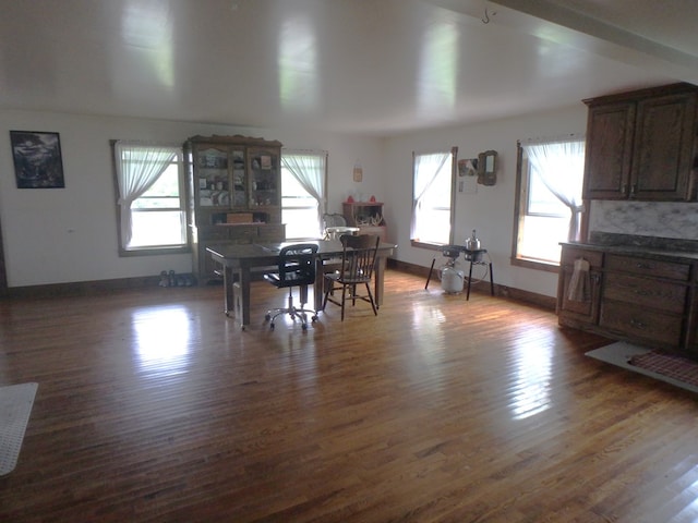 dining space with dark hardwood / wood-style floors