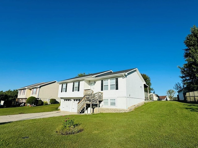 view of front of property with a garage and a front yard