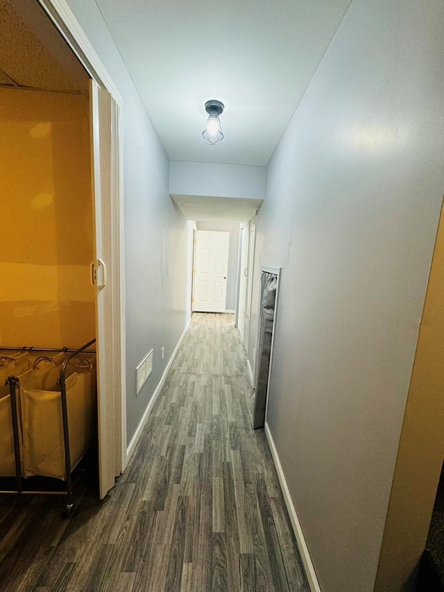 hallway featuring dark hardwood / wood-style flooring