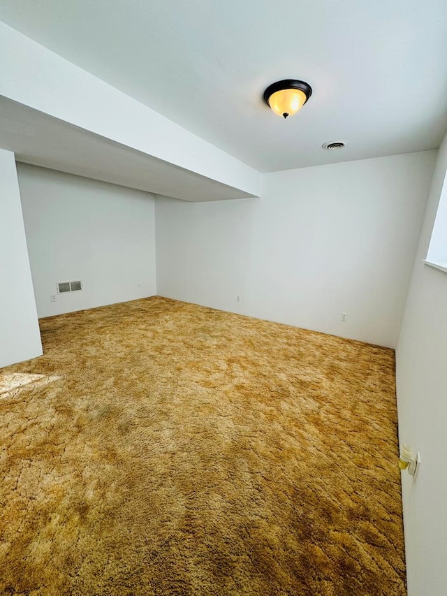 basement featuring carpet flooring