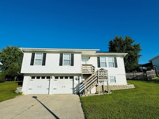 bi-level home with a front yard and a garage