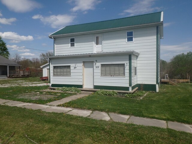 302 N King St, Brashear, MO 63533 - view of front of house with metal roof and a front yard