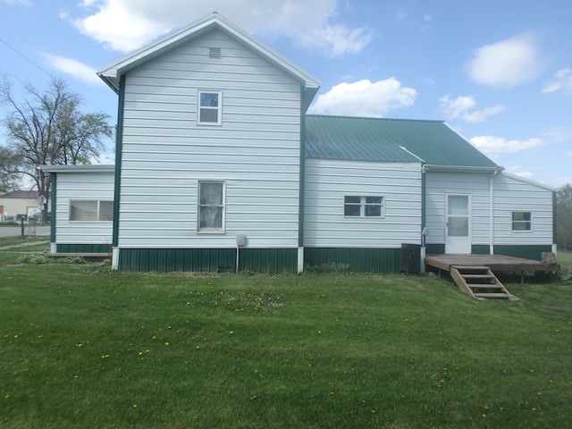 302 N King St, Brashear, MO 63533 - back of property featuring a lawn, metal roof, and a deck