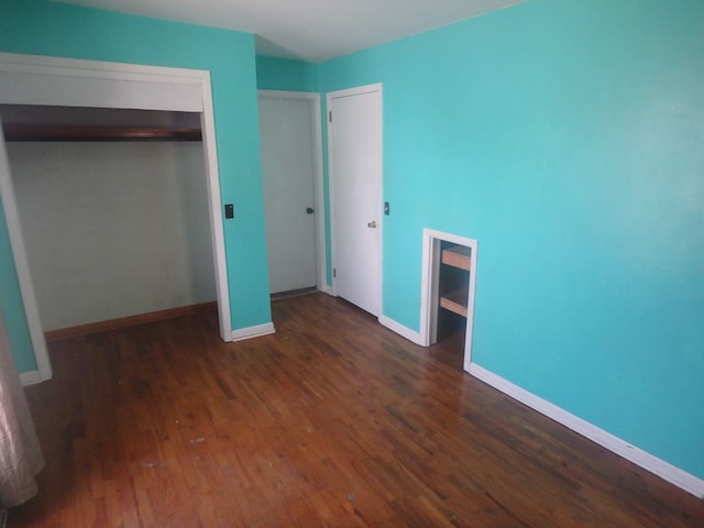 302 N King St, Brashear, MO 63533 - unfurnished bedroom featuring wood finished floors, a closet, and baseboards