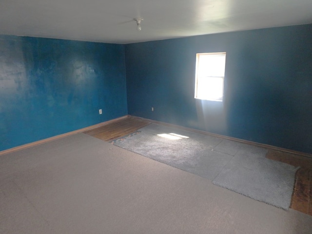 302 N King St, Brashear, MO 63533 - empty room with baseboards and carpet floors
