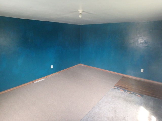 302 N King St, Brashear, MO 63533 - spare room featuring baseboards and carpet flooring