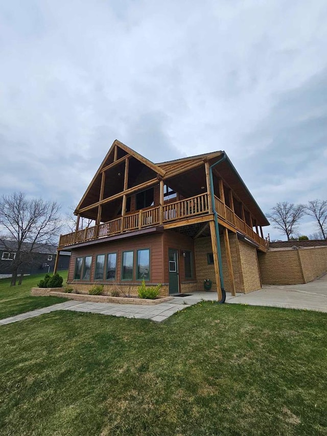 rear view of property with a yard