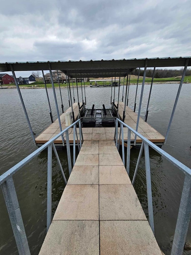 view of dock with a water view and boat lift
