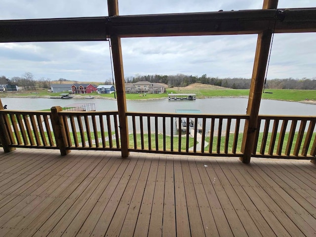 wooden deck featuring a water view