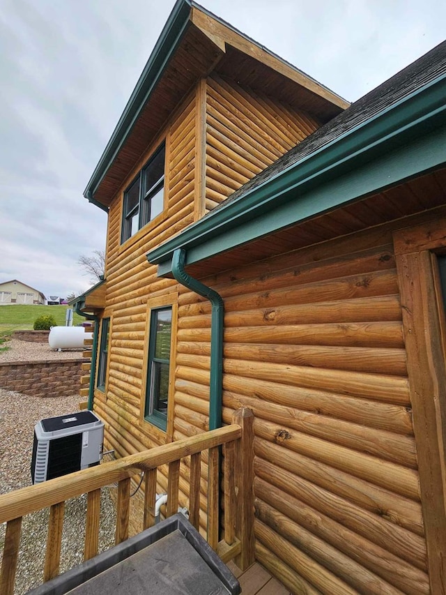 view of property exterior with central AC unit