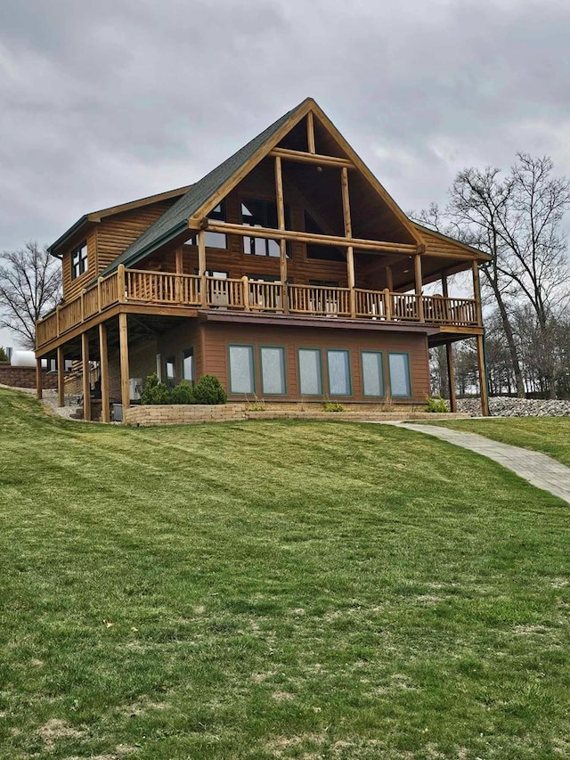 back of property featuring a lawn and a deck