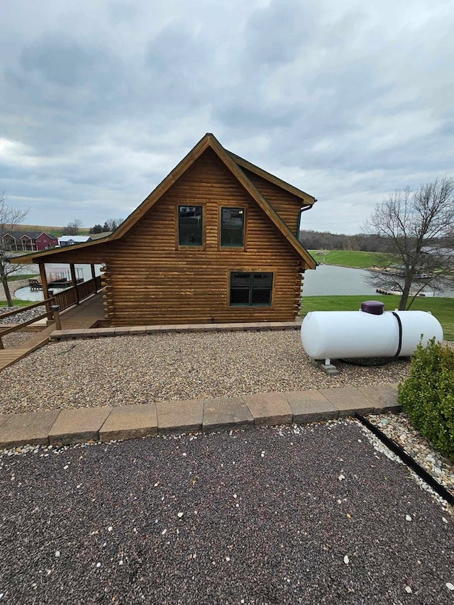 view of property exterior featuring log exterior