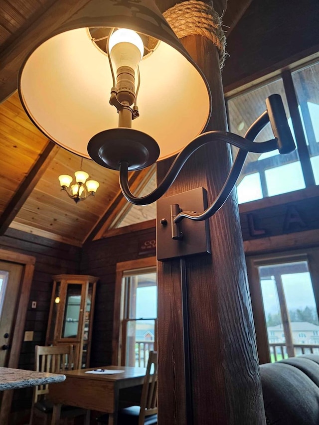 details featuring wooden ceiling, wooden walls, beam ceiling, and a chandelier