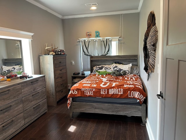 bedroom featuring crown molding and dark wood-type flooring