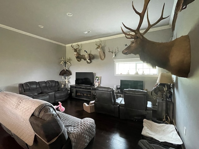 living room featuring dark hardwood / wood-style flooring and crown molding