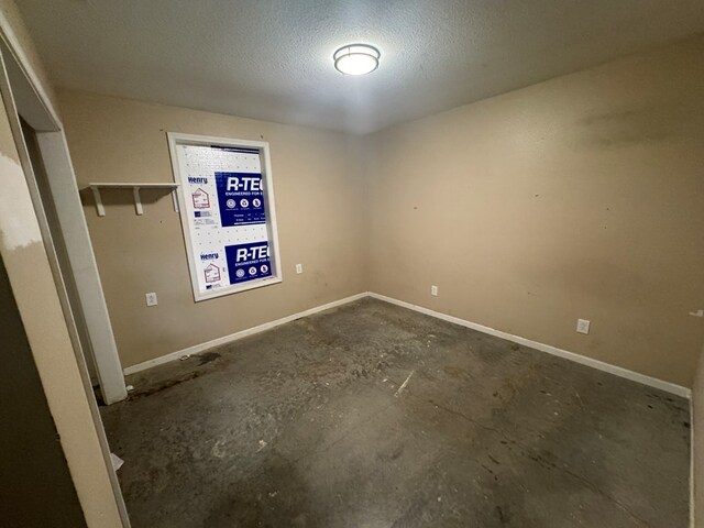 2116 S Franklin St, Kirksville, MO 63501 - unfurnished room featuring a textured ceiling and baseboards