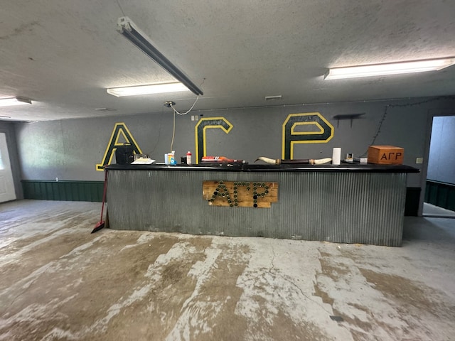 2116 S Franklin St, Kirksville, MO 63501 - kitchen with unfinished concrete flooring, a textured ceiling, and dark countertops