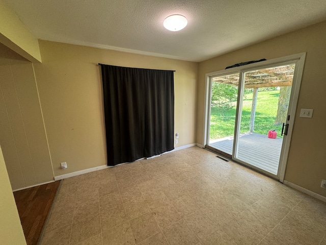 2116 S Franklin St, Kirksville, MO 63501 - empty room with baseboards and a textured ceiling