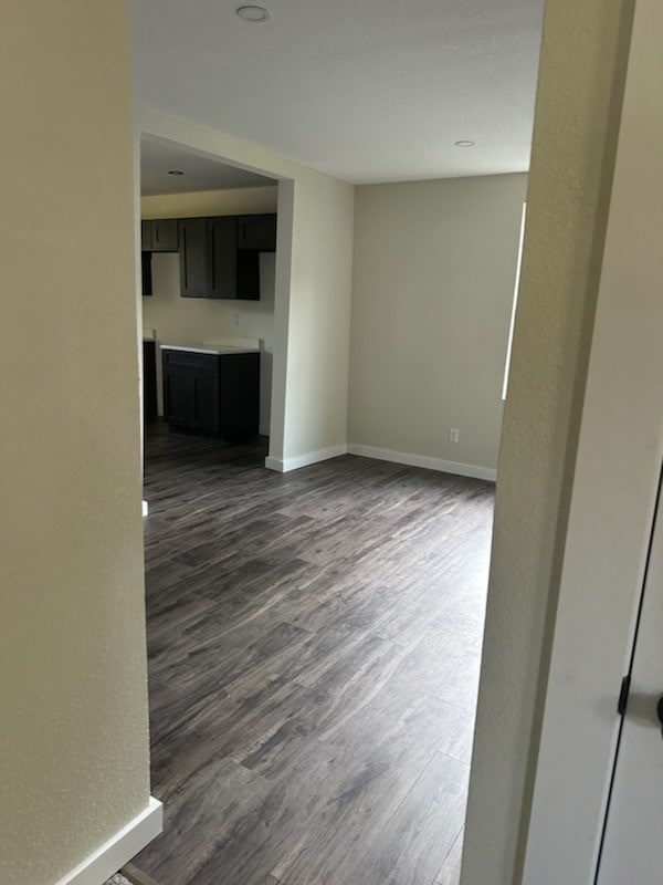 spare room featuring dark hardwood / wood-style flooring