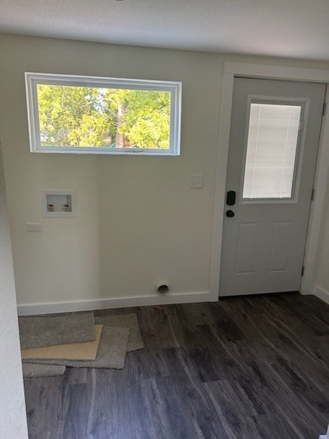 laundry room featuring dark wood-type flooring and hookup for a washing machine