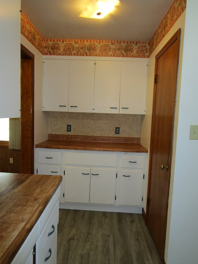1703 S Downing, Kirksville, MO 63501 - kitchen with wood counters, dark wood finished floors, and white cabinetry
