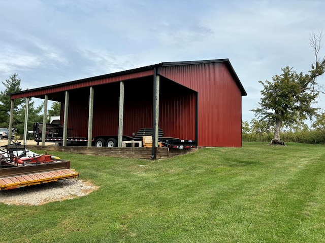 view of outbuilding featuring a yard