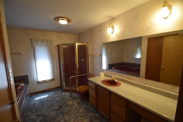 bathroom with vanity, a garden tub, toilet, and a stall shower