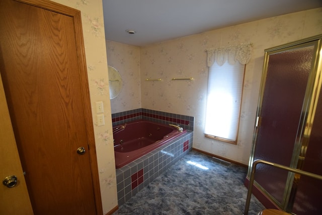 full bath featuring wallpapered walls, a garden tub, and baseboards