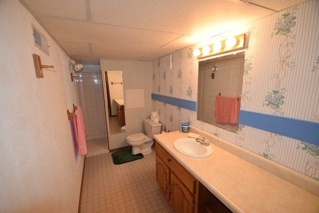 full bath with visible vents, toilet, a stall shower, wallpapered walls, and vanity