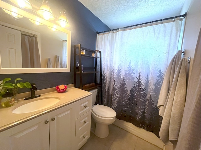 bathroom with a textured ceiling, vanity, toilet, a shower with shower curtain, and tile patterned floors